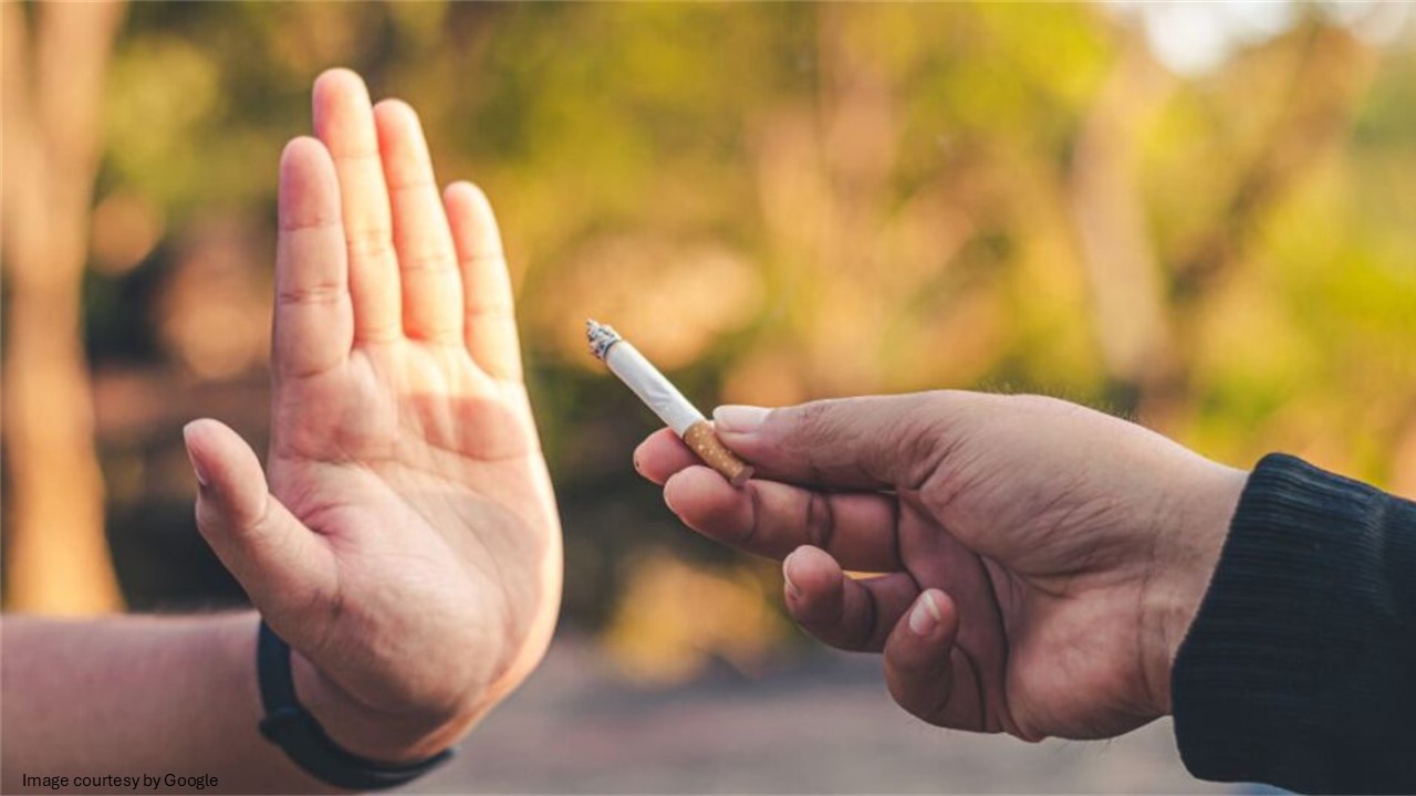 Hand showing no sign to cigarette