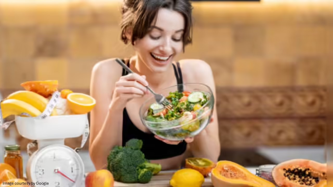 A girl with a bowl of salad