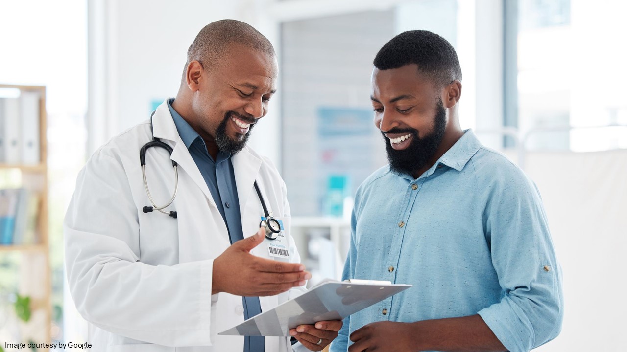 Doctor discussing report with a man