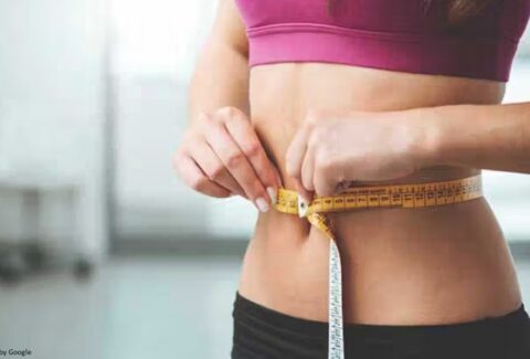A person working out with determination, aiming for 30-pound weight loss through exercise.