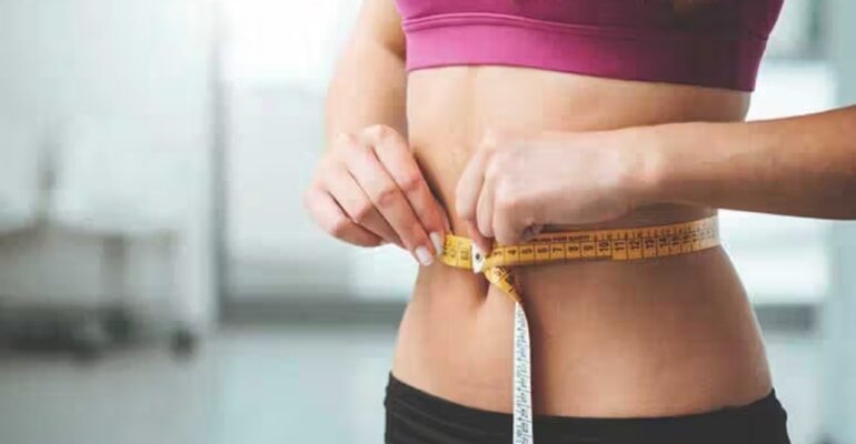 A person working out with determination, aiming for 30-pound weight loss through exercise.
