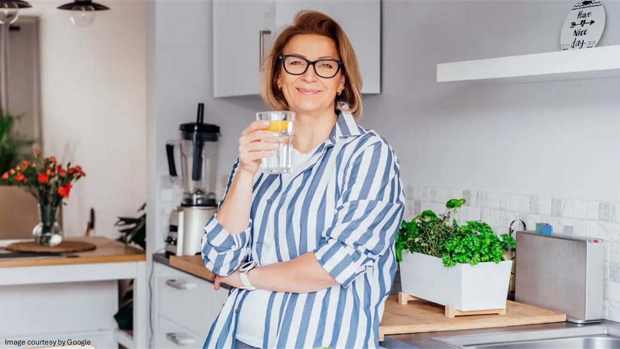 A lady holding a glass