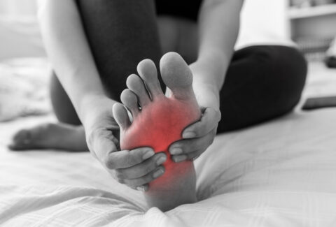 Image of Leg and Foot Cramps at Night: A person experiencing nighttime leg and foot cramps, characterized by involuntary muscle contractions causing discomfort during sleep.