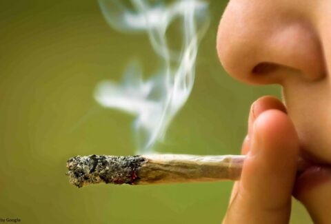 "Image of a woman smoking, a risk factor for high blood pressure.