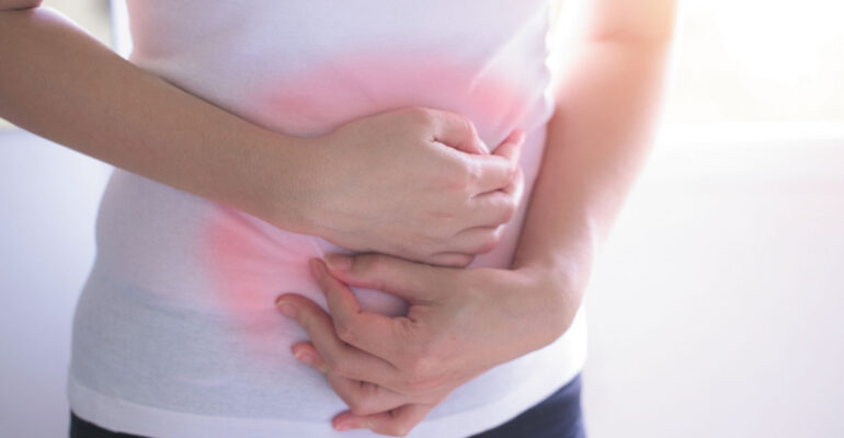 Person Experiencing Constipation Discomfort