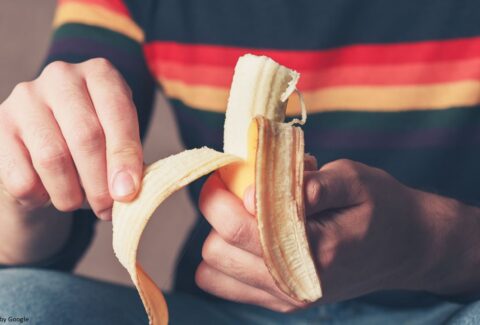 Person enjoying a ripe banana.