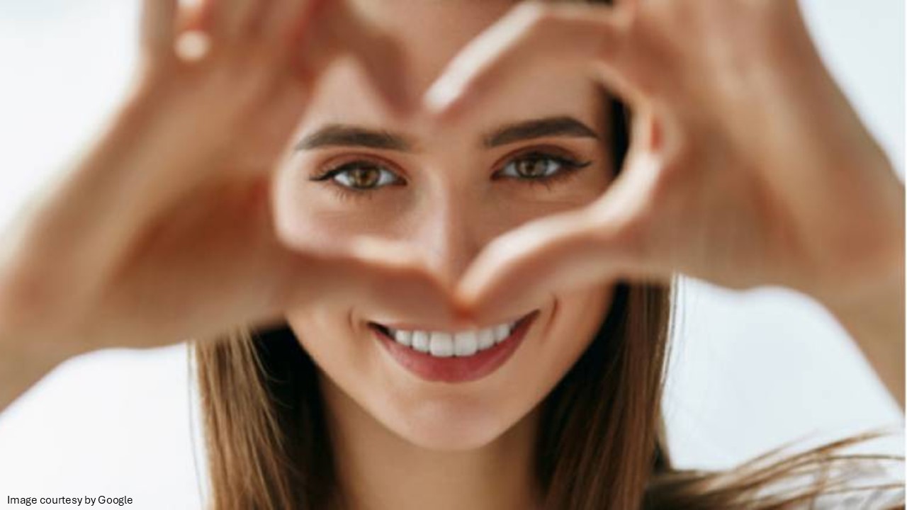 Girl making heart sign with her hands