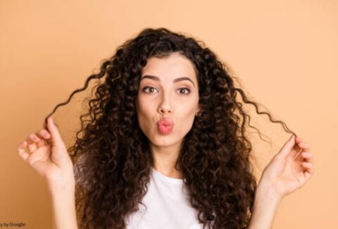 Girl with curly hair - All Day Chemist