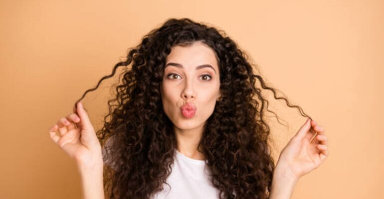 Girl with curly hair - All Day Chemist