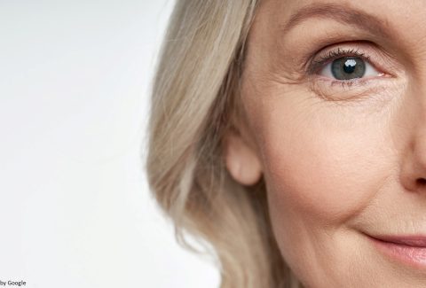 Woman Applying Anti-Wrinkle Cream for Skincare Treatment