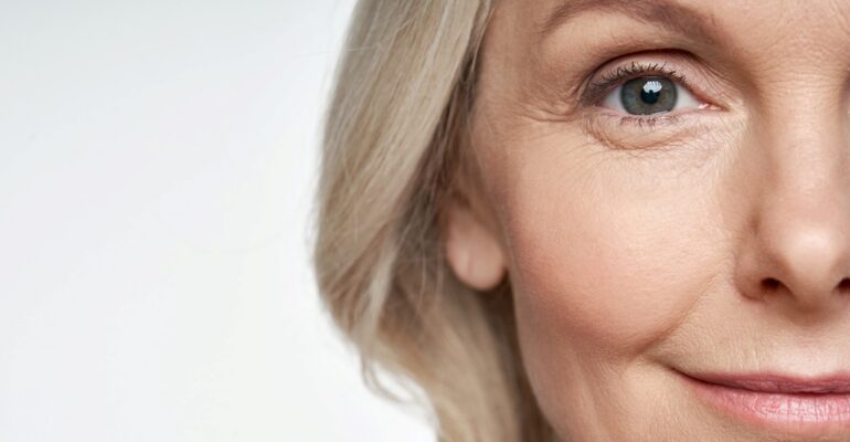 Woman Applying Anti-Wrinkle Cream for Skincare Treatment