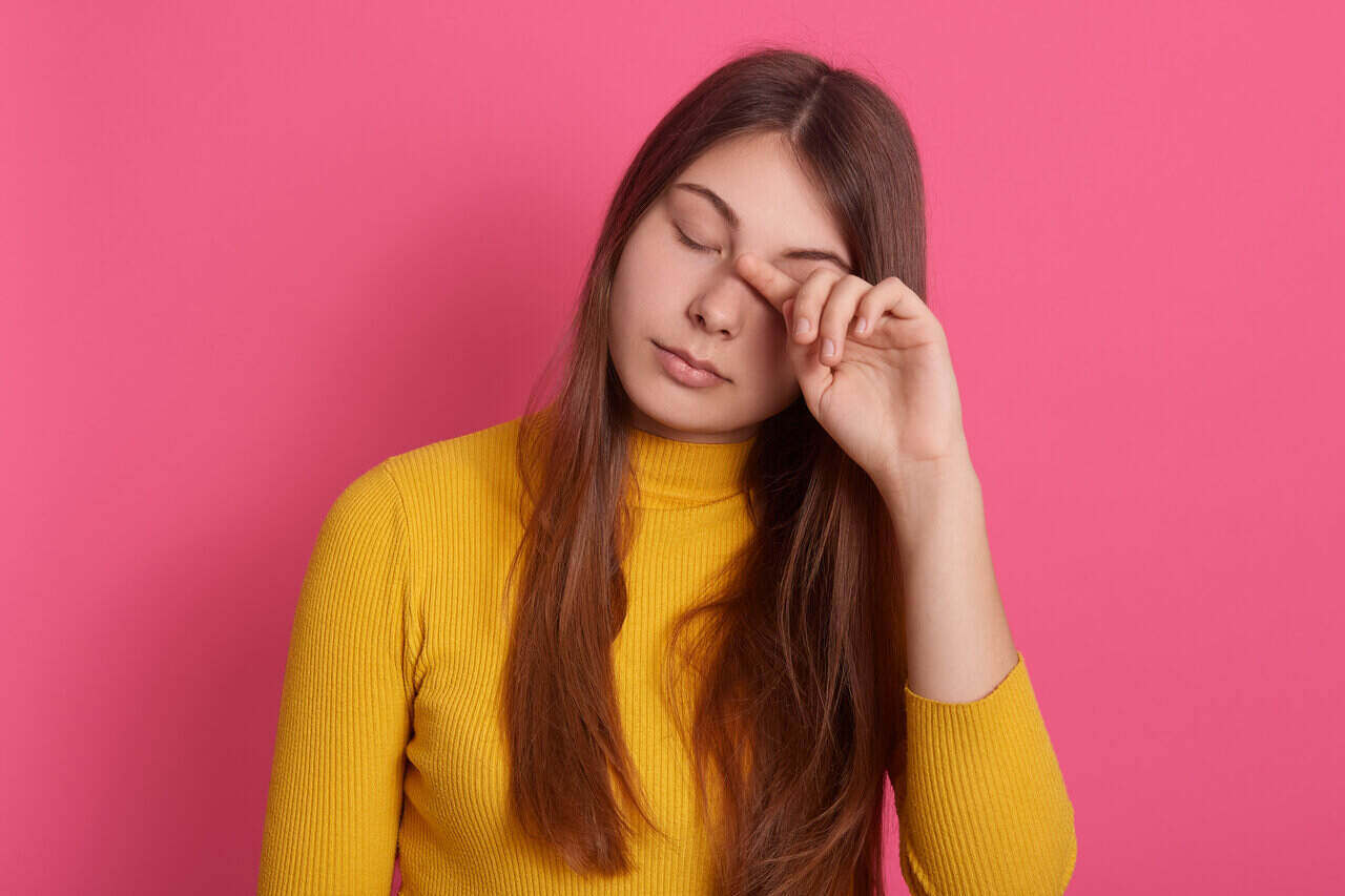 Closeup portrait of tired woman with closed eyes