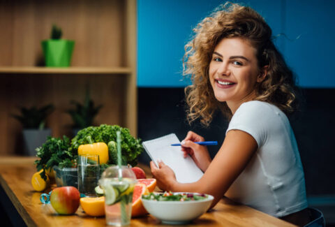Women sitting and enjoying nutritious meal while discussing nutrition tips for women's health