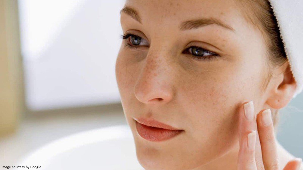 Person using hydroquinone cream to address skin concerns