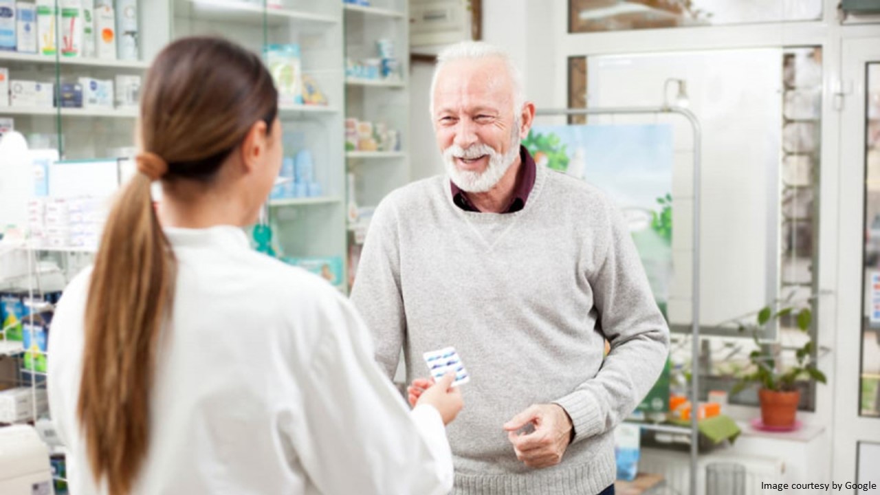 Person Providing Guidance on Sildenafil Dosage to Elderly Man