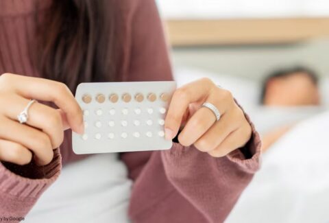 Hands Holding Birth control pills