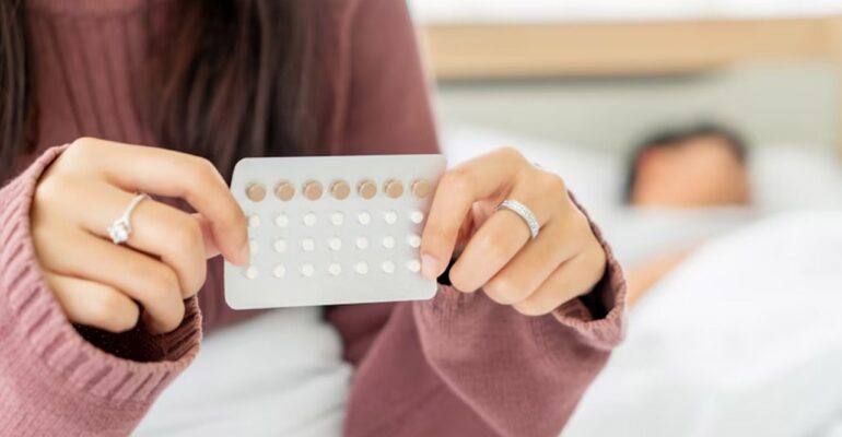 Hands Holding Birth control pills