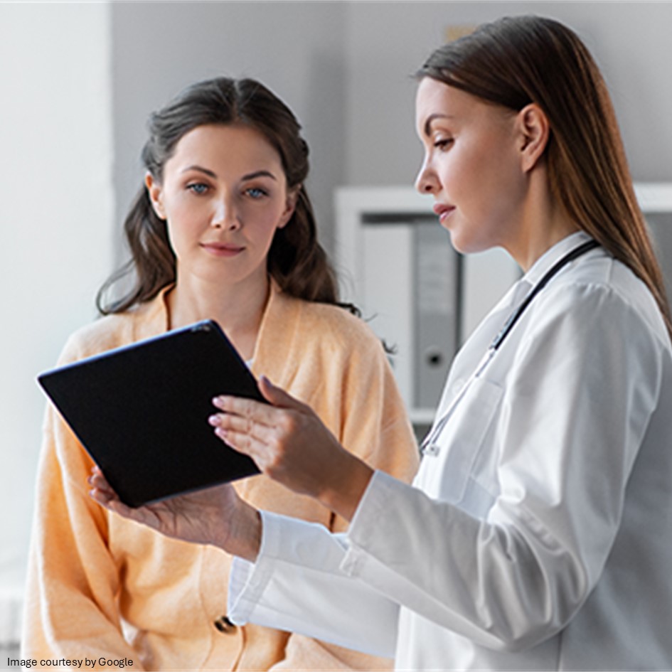 Doctor showing report to paitent