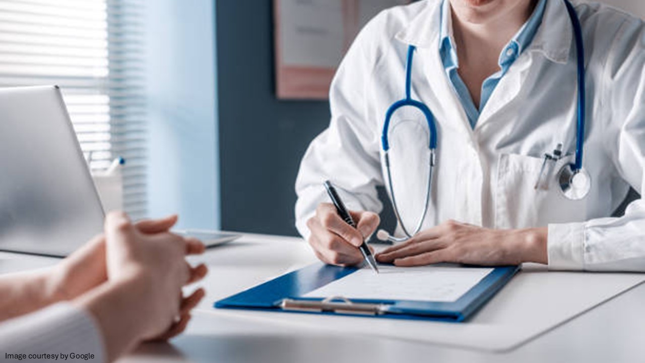 A doctor writing something on paper