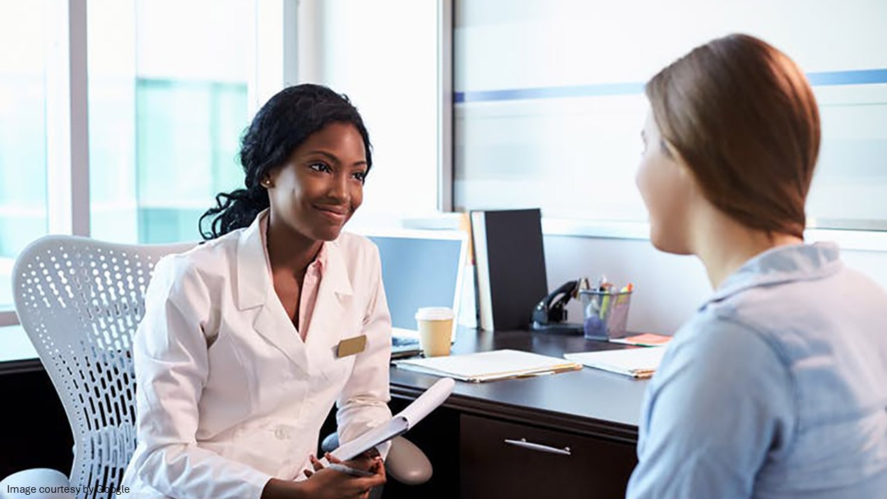 Female doctor consulting with patient in medical office