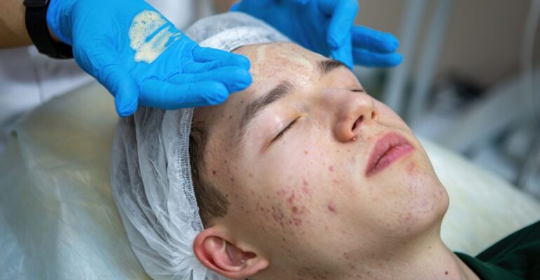 Doctor doing treatment on patient with acne