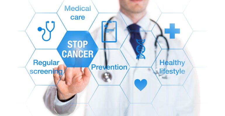Doctor clicking stop cancer button