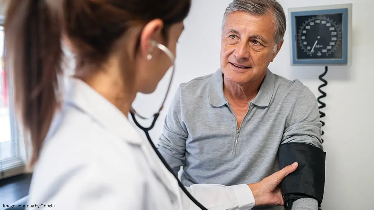 doctor consulting patient checking blood pressure