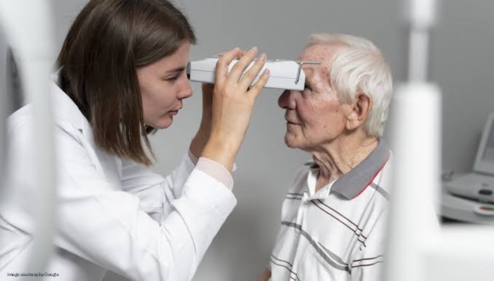 doctor checking eyes of patient