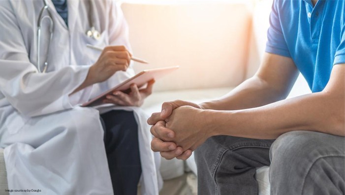doctor with male patient